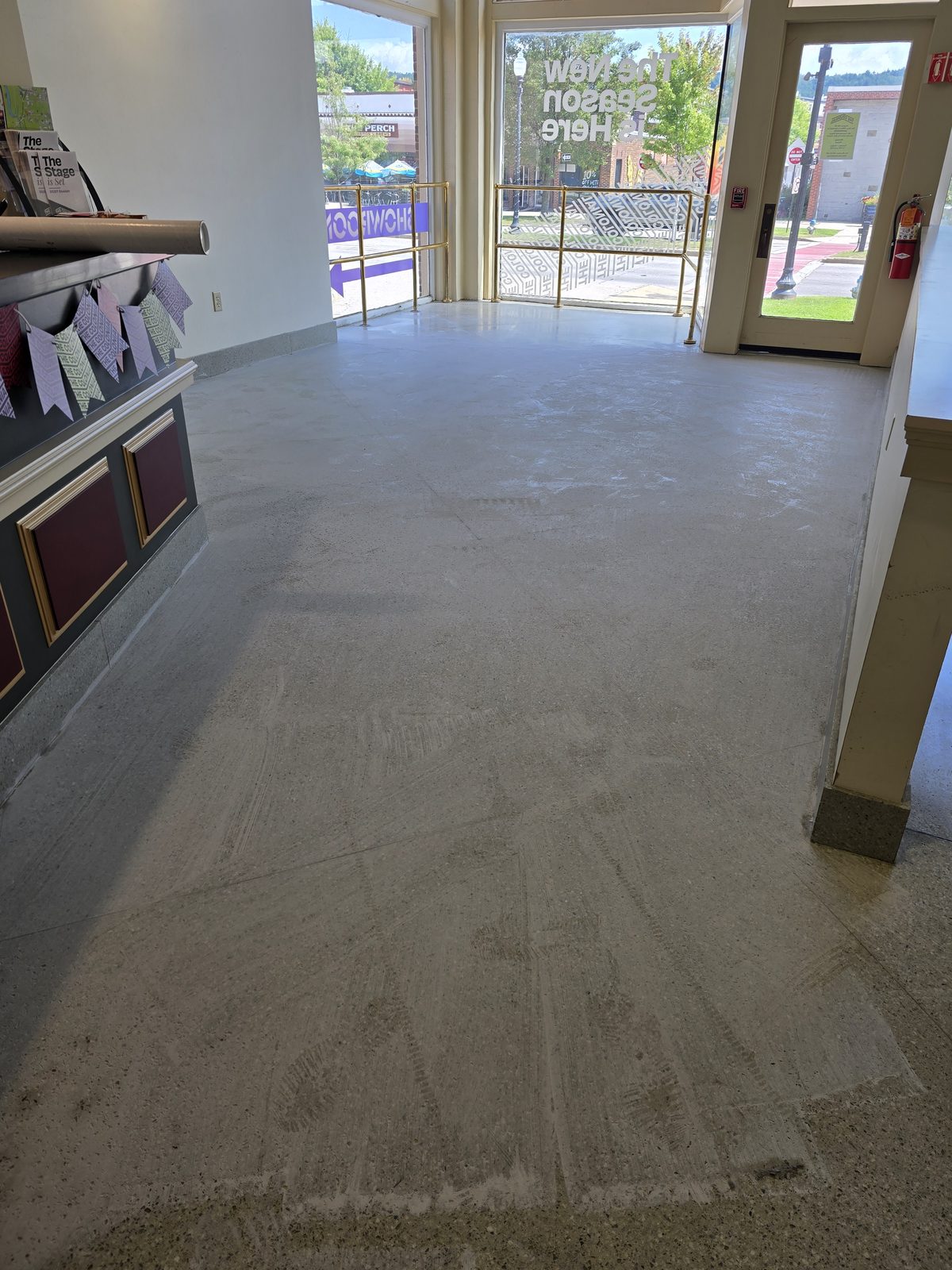 Dull worn terrazzo lobby floor before polishing