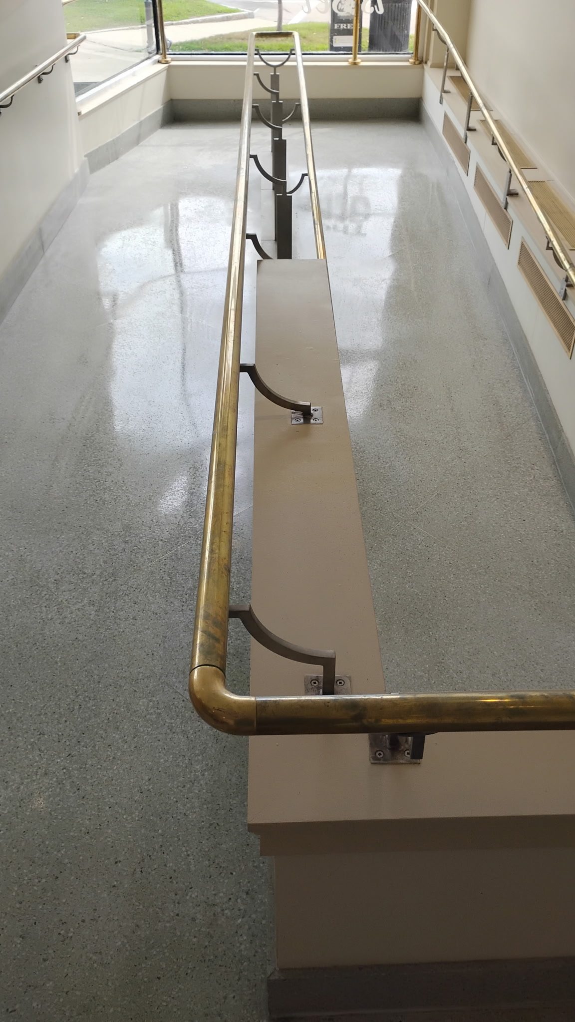 Polished terrazzo entrance ramp after